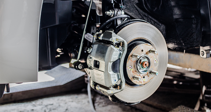 view of car brakes with wheel removed
